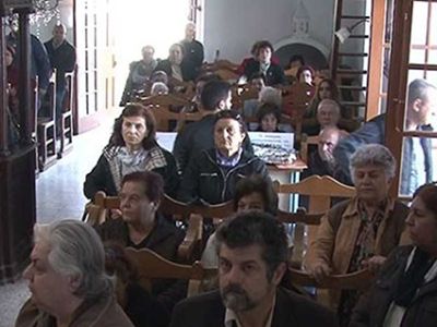 Greek Cypriots conduct a religious ceremony in Büyükkonuk